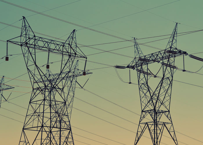 power lines with green sky